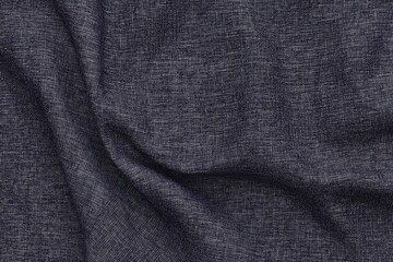 Fototapeta premium An intimate view of dark blue fabric, showcasing the fine weave and a hint of sheen in the texture..