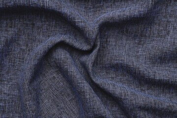 Naklejka premium A detailed close-up of dark blue fabric, revealing its fine weave and the delicate sheen across its surface..