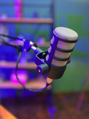 Professional microphone at a radio station or studio, entertainment and communication concept. Podcast, live, bright lights