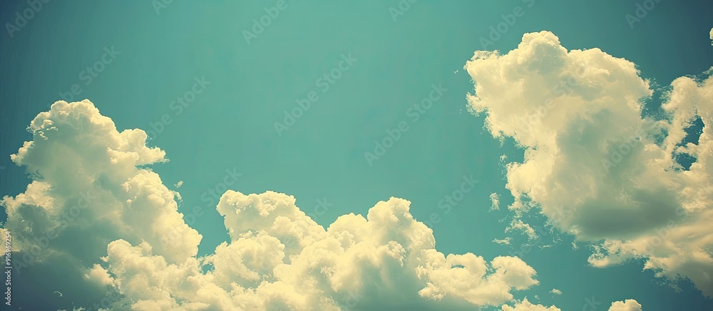 Aufkleber vintage hipster background featuring a beautiful blue sky with fluffy white clouds ideal for adding 