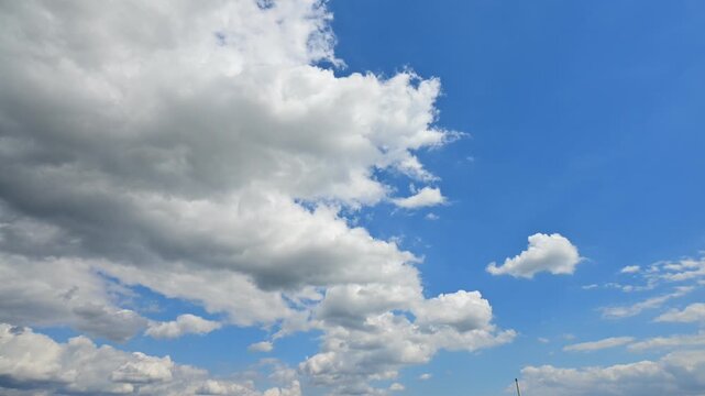 time lapse of white clouds moving towards the horizon