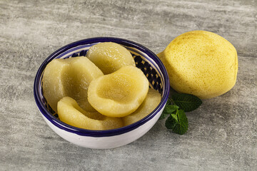 Canned yellow pear with syrup