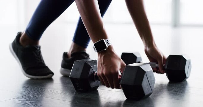 Woman, hands and weight closeup gym or workout cardio training, muscle fitness or shoes. Female person, legs or dumbbell smart watch exercise equipment or strong glutes, athlete routine and power