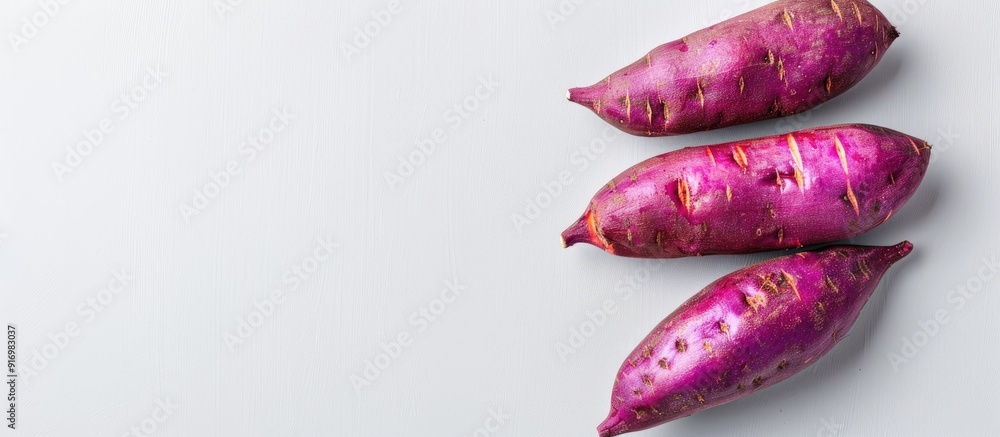 Poster sweet potato on a plain white backdrop with copy space image