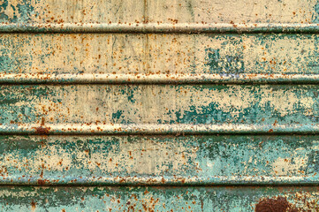 Old rusty metal sheet texture. Abstract wall grunge background. Oxidation on iron plate.