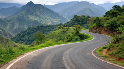 Naklejka premium Winding Road Through Lush Green Mountains on a Cloudy Day, Perfect for Road Trips and Scenic Drives
