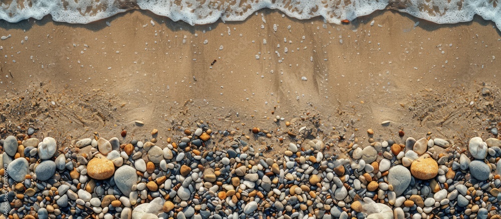 Poster top view of a sandy beach with pebbles at the edges ideal for copy space image
