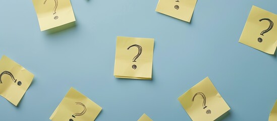 Stock photo showing interview questions written on yellow notepaper with copy space image