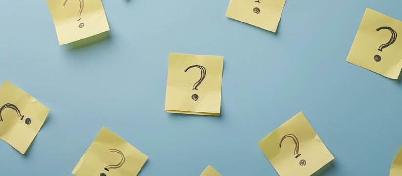 Stock photo showing interview questions written on yellow notepaper with copy space image
