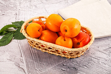 Raw ripe sweet apricots heap