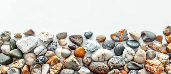 Obraz premium An assortment of various pebbles found along the Black Sea coast set against a blank copy space image