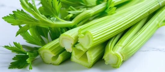 Obraz premium Close up of celery with a white background provides ample copy space image
