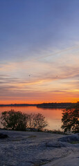 beautiful sunset in orange intensive colors in hietaniemi beach in helsinki finland