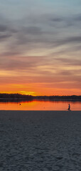 beautiful sunset in orange intensive colors in hietaniemi beach in helsinki finland