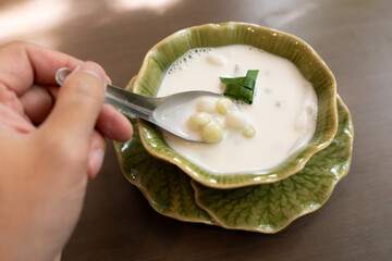 Bua Loy is a traditional Thai dessert made of glutinous rice flour balls in coconut milk. The soft,...