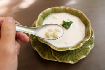 Bua Loy is a traditional Thai dessert made of glutinous rice flour balls in coconut milk. The soft,...