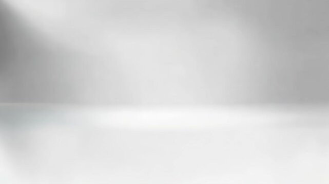 A minimalist background featuring soft, diffused light and a smooth surface, ideal for product placement and photography.