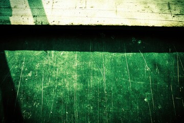 Fototapeta premium Minimalist Close-Up of Wooden and Green Surfaces with Scratches - Artistic Texture for Design and Background Use