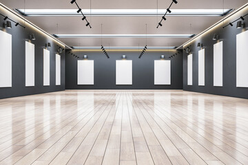 Modern gallery interior with blank frames on dark walls and wooden flooring. 3D Rendering