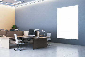 Modern office interior with blank vertical poster on gray wall. 3D Rendering