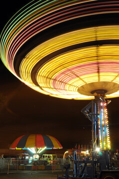 Long exposure of carnival rides at night