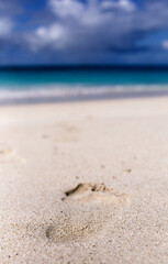 Footprint in sand at Darkwood Beach Antigua