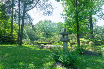 A serene Japanese Garden with a traditional stone lantern, ideal for relaxation and meditation