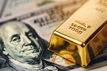 Close-up of a gold bar next to a hundred-dollar bill, symbolizing wealth and investment in valuable assets.