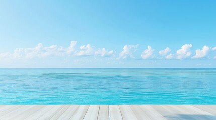 Obraz premium Serene ocean view with clear blue sky and fluffy clouds, seen from a wooden deck. Perfect for summer and vacation themes.