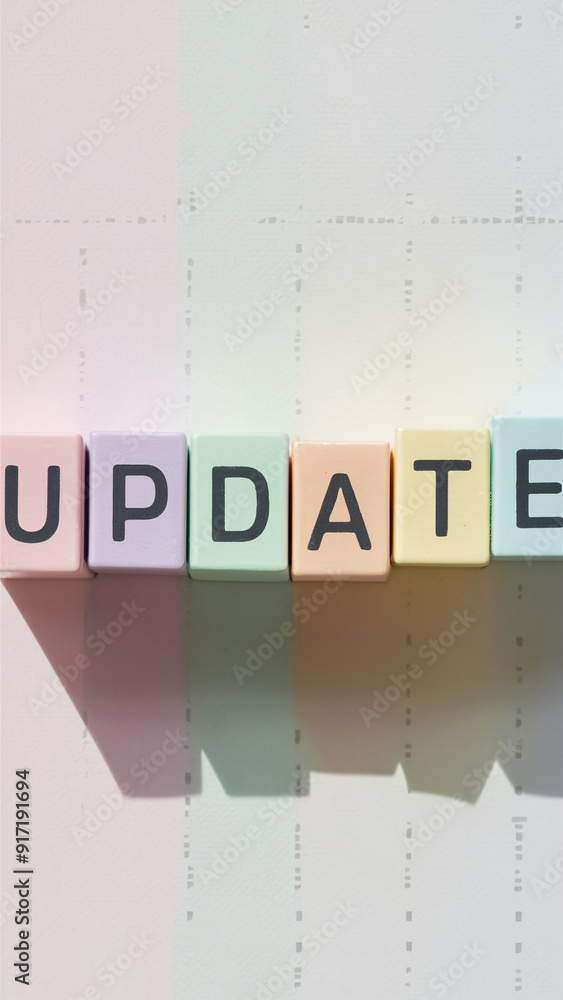 Poster pastel-colored blocks spelling 