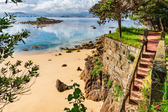 Ratas beach in Cangas de Morrazo with views of the Ratas island and the city of Vigo on the other side of the lower estuaries, Pontevedra.