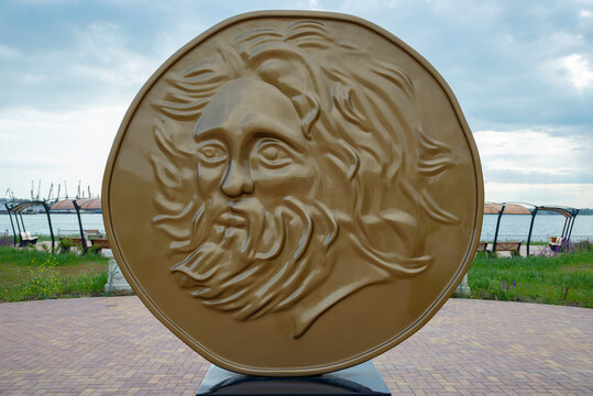KERCH, CRIMEA - MAY 19, 2024: The image of a satyr's head on a monument coin (golden stater from the Panticapeum). Kerch, Crimea