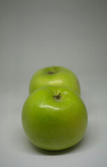 a green apple with a white background