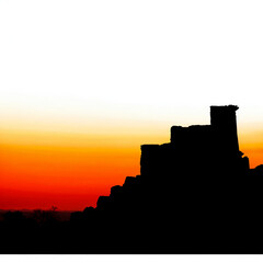 Fototapeta premium Silhouette of Ancient Ruins Against a Colorful Sunset Sky