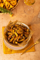 Vegetarian German spaetzle with fried chanterelles and onions served in a frying pan