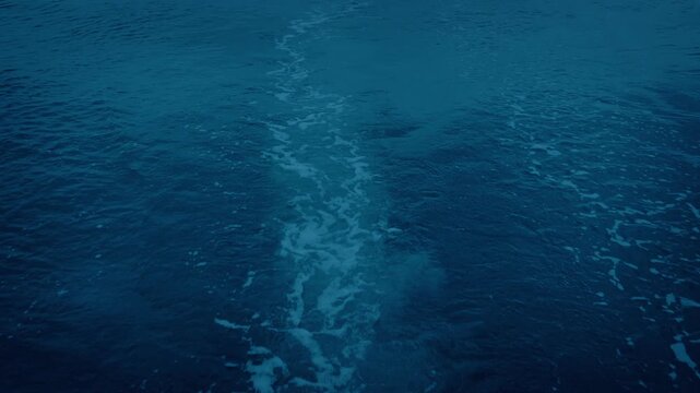 Wake At Back Of Sailing Boat In The Evening
