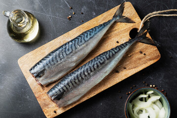 Fresh Mackerel on Cutting Board. Raw Mackerel on Dark Background