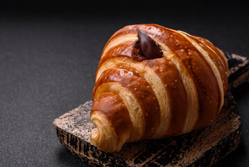 Delicious crispy sweet croissant cornet with chocolate