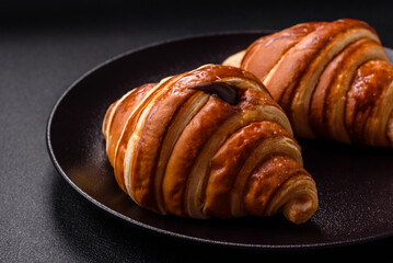 Delicious crispy sweet croissant cornet with chocolate