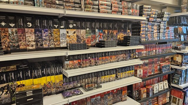 Shelves Filled with Warhammer Miniature Model Boxes in Store
