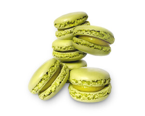 Green pistachio macaron isolated on white background with shadow. Macaroons, sweets isolated on white background.