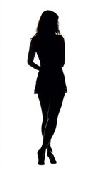 Fototapeta premium A woman stands elegantly, her silhouette framed by bright light behind her