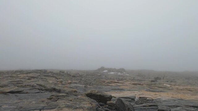 Snowy wind and fog on Maroma peak in thunderstorm day, Sierra Tejeda, Spain 