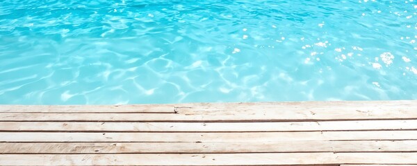 Crystal clear water reflecting sunlight near wooden deck in tropical paradise
