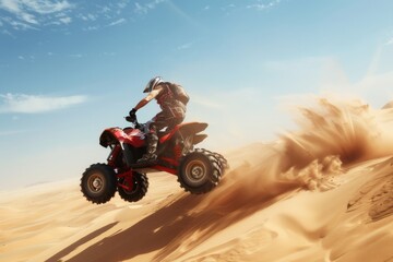 A thrilling moment captured as an individual rides an ATV mid-air, kicking up sand against a backdrop of vast, sunlit desert dunes under a clear sky.