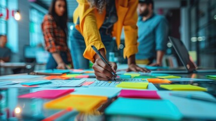 A diverse team collaborates in a modern office, using sticky notes and a whiteboard to brainstorm ideas.
