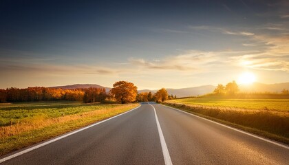 road across countryside at autumn sunset