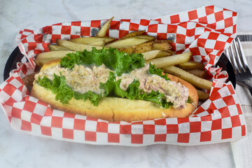 tuna sub roll served with  french fries
