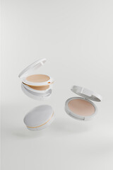 Powder box flying over white background . Beauty and fashion concept. 3d render