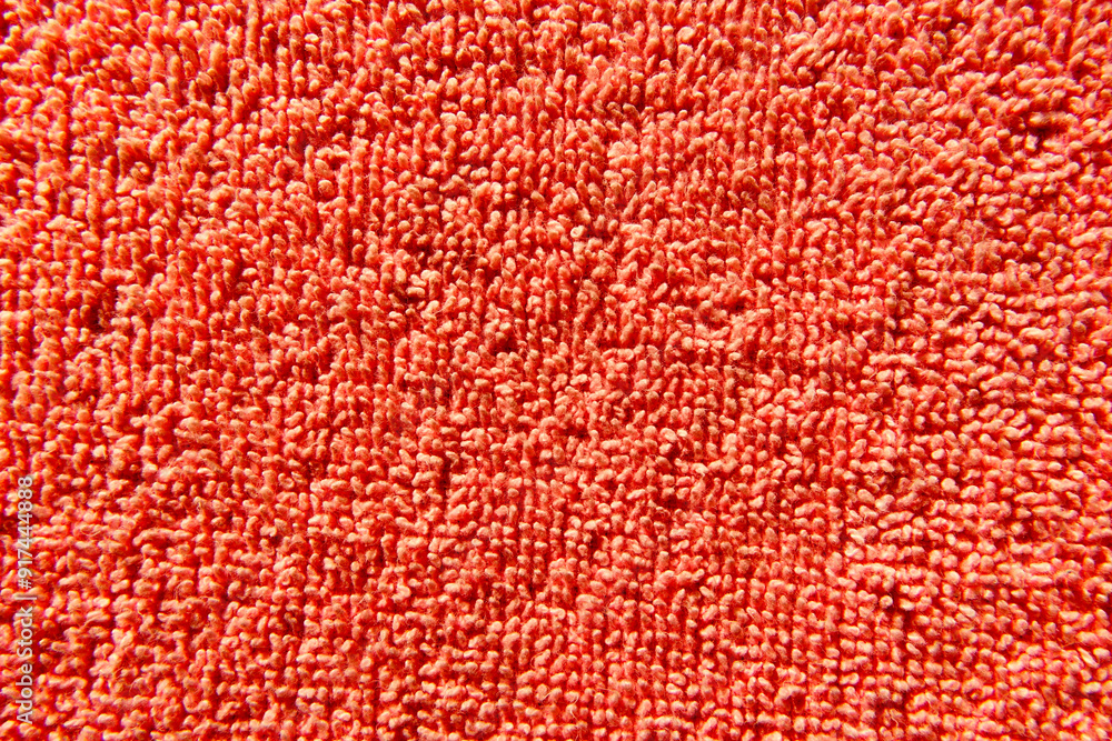 Aufkleber pile of textured pink fabric creating a soft, vibrant background during bright daylight